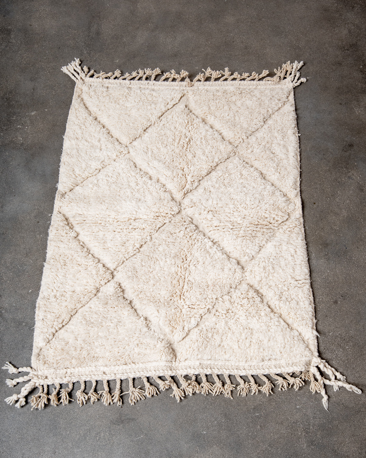 Modern, designer, handcrafted Berber rug from Morocco. Beniourain carpet with minimalist design, natural wool pile and a fluffy texture.